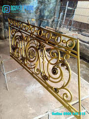 Golden decorative wrought iron railings
